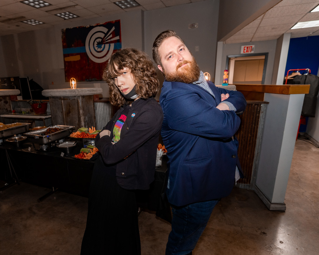 Sam and Ryan back to back in front of the snacks