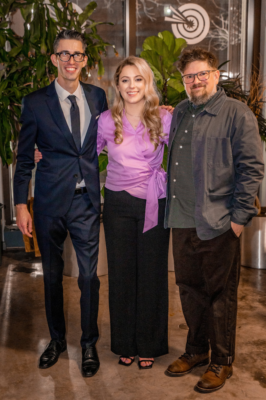Mattew, Raichel, and Dan posing for a photo at the party